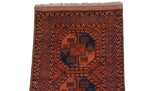 Ersari design rug detail: chestnut brown elephant guls, navy diamond lattice border.