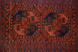 Geometric elephant footprint gul motifs and diamond lattice border, chestnut brown, navy, saffron.