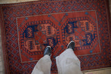 View from above showing the scale of an Ersari rug's geometric elephant footprint gul motifs.