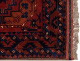 Original side cord selvage and full pile on the corner of a vintage Ersari design rug.