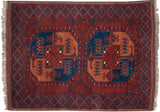 Vintage Pakistani Ersari rug with geometric guls in sapphire blue and apricot on a dark brick red field.