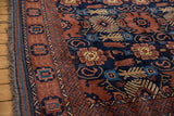 Vintage Taghan carpet border, dark copper field, navy geometric, floral patterns, fringe.
