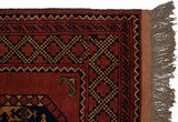 Chestnut Ersari rug corner displaying checkered main border, intact side selvage, and natural fringe.