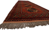 Secured end of the vintage Ersari runner, showing chestnut hues and brown fringes.