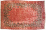 Vintage Kerman carpet with a dusty rose open field and an elaborate Rococo-style scrolling vine border.