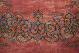 Detailed view of the European Rococo scrolling vine border in shades of blue and pink.