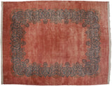 Vintage Kerman rug with a vast dusty rose field and a floating Rococo blue vine border.