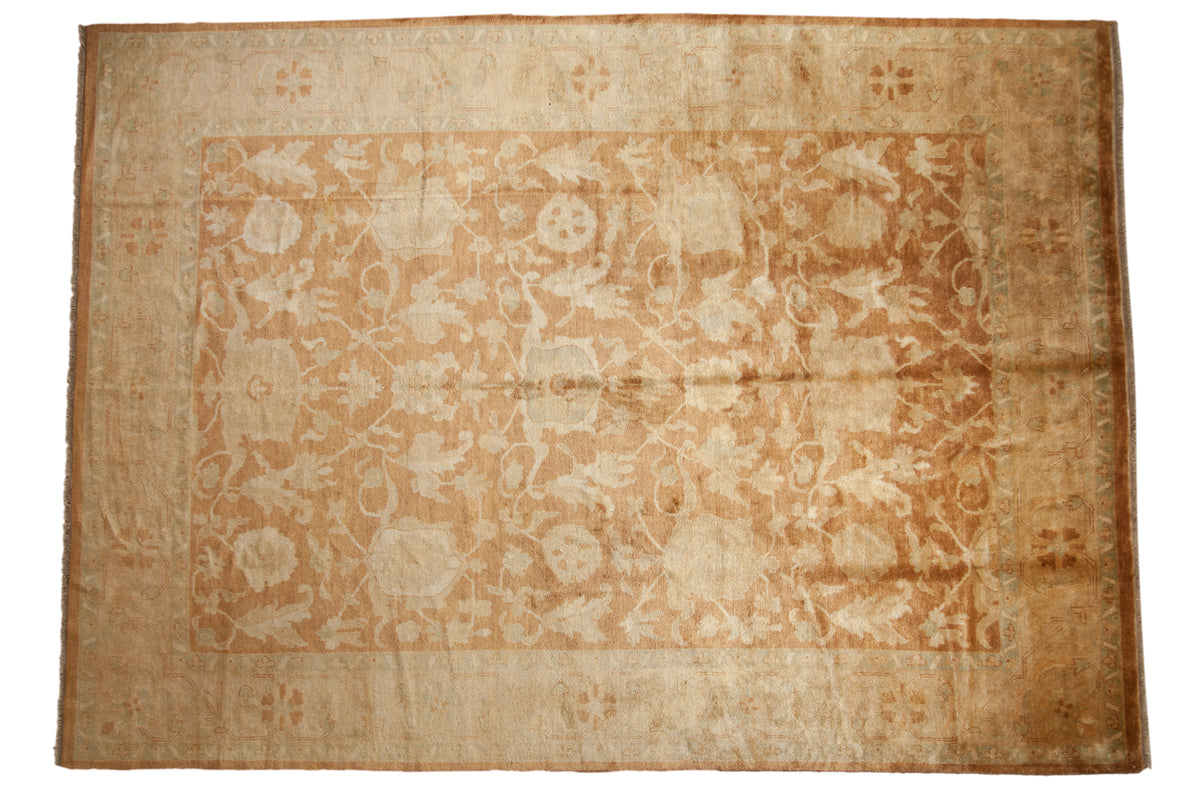 Vintage Oushak design carpet with a gold wash field of oversized turtle Samovar motifs in copper and beige.