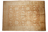 Vintage Oushak design carpet with a gold wash field of oversized turtle Samovar motifs in copper and beige.