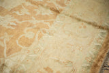Soft plush wool pile of a vintage carpet in pale copper, wheat, and sea foam green.