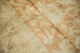 Plush, high-luster wool pile with pale copper, bronze, and sea foam green design details.