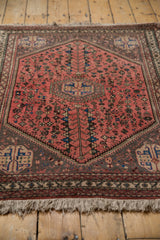 Stepped diamond medallion corner with playful geometric motifs on a dusty blush Abadeh rug.