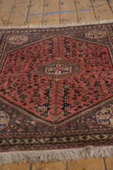 Dusty blush field displaying intricate germinating plant and geometric motifs on a vintage Abadeh rug.