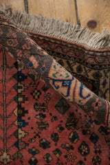 Vintage Persian Abadeh rug with full pile, showing light fringe and colorful folk motifs.