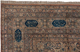 Signature cartouches with poetic inscriptions on the navy and copper border of an antique Kermanshah.