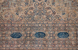 Navy blue poetic cartouches in the main border of a late 19th-century Persian Kermanshah carpet.