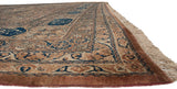 Low perspective on an antique Kermanshah's cartouche border, intact selvage, and original fringe.