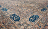 Signature navy blue cartouches with poetic inscriptions on the main border of an antique Kermanshah carpet.
