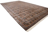 Angled view of a vintage Bulgarian Tabriz carpet showing the full length and garden panel design.