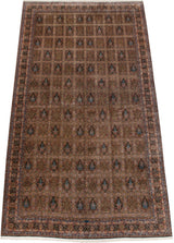 Perspective view of the oversized Bulgarian Tabriz carpet showing its detailed garden panels.