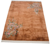 Vintage Art Deco carpet, dimensional carved copper field and blush floral branches.