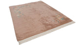 Plush dusty rose pile, original ivory fringe, and intact selvage of the vintage rug.