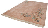 Plush pile and intact ivory fringe of the pale dusty rose Japanese Art Deco rug.