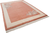 Apricot Art Deco carpet with wide ivory border, corner floral sprays, and full pile.