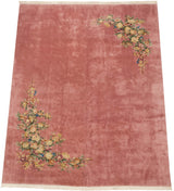 Dimensional shadow embossed carving on pink field with detailed floral foliage.