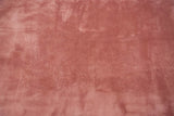 Polished wine red wool pile with shadow embossed Art Deco foliage and vines.