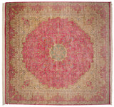 Vintage Bulgarian Kerman design carpet with a starburst medallion on a pink millefleur field.