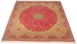 Angled view of a square Bulgarian Kerman design carpet showing its pink millefleur field and scale.