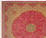 Intricate floral vinery within the ivory and seafoam green border of a vintage Kerman design carpet.