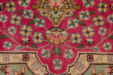 Intricate floral vinery in blue and dusty gold on the full bubblegum pink pile.