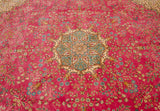 Angled view of the Kerman design rug's starburst medallion and detailed millefleur field.