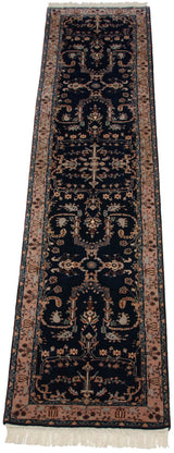 Traditional Mohajeran Sarouk runner's navy blue field with beige floral branches and buds.