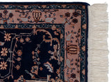 Traditional Mohajeran Sarouk rug corner with ivory fringe and ornate pinkish-beige border.