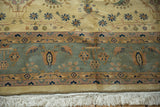 Fringe and borders of an Indian Mohajeran Sarouk rug, with antique ivory, slate blue-gray, and dusty blush florals.
