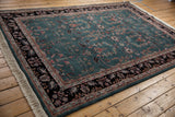 A vintage Indian carpet with a sprawling Mohajeran Sarouk design, viewed from an angle.