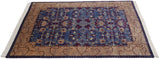 Vintage Indian rug with a plush pile, angled to show the floral Arts and Crafts pattern.