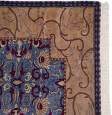 Corner of an Arts and Crafts carpet showing its plush pile, blue floral border, and intact side selvage.
