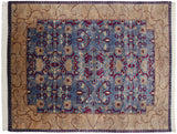 Scrolling leaves and floral motifs in wine red and beige on the carpet's denim blue field.
