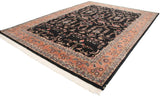 A vintage Indian Mohajeran Sarouk carpet shown at an angle, displaying the full floral pattern.