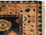Vintage Indian Azeri carpet corner: navy field, antique ivory border with germinating floral motifs, and fringe.