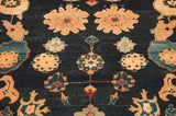 Intricate copper and teal floral cross-sections with buds on navy Azeri carpet.