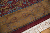 White fringe, wine red border, and gold field with Arts and Crafts scrolling vines.
