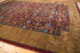 Gold border with shadow vines meets the wine red floral field of this Arts and Crafts carpet.