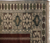 Vintage Melas rug corner, coffee brown and dusty green geometric borders, full pile height.
