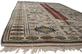 Hand knotted vintage Melas rug corner, original selvage, and full fringe.