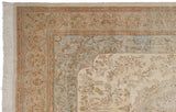 Vintage Tabriz carpet corner showing intact ivory fringe, beige floral border, and scalloped spandrel.
